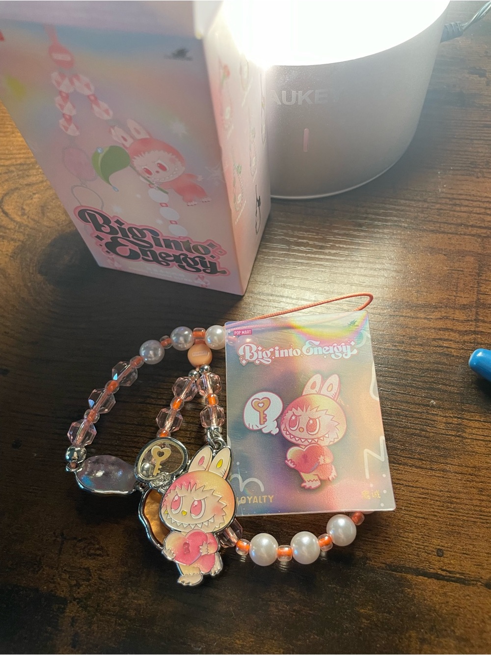 Big into Energy phone charm: loyalty